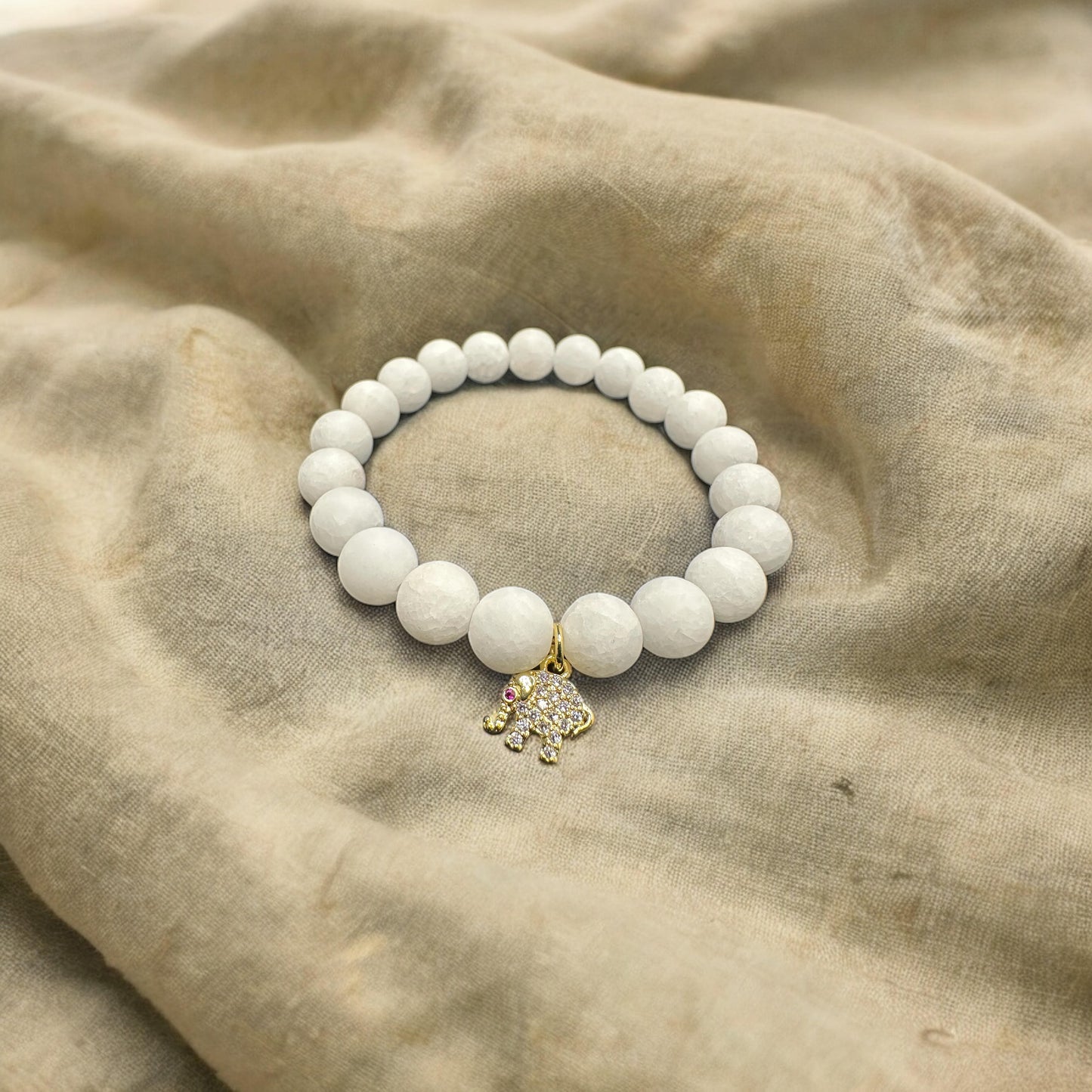 White natural jade with 18k gold plated elephant charm