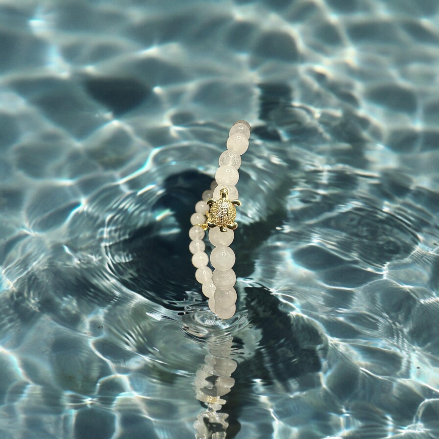 White jade with 18k gold plated turtle and star fish charm